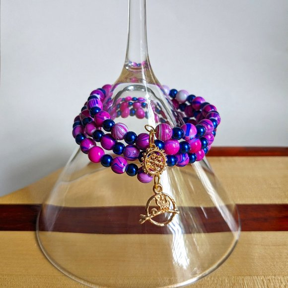 Jewelry - Purple and blue memory wire bracelet with gold finishing charms